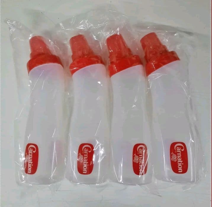 (4ชิ้น)ขวดบีบคาร์เนชั่น Carnation ฝาเกลียว แน่นหนาขนาดความจุ 750 ml ฝาขวดใช้ตวงได้ (1ฝา=60ml) (รับ6,200แต้ม)